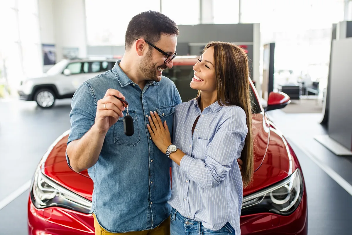 Customers receiving the keys to their BMW